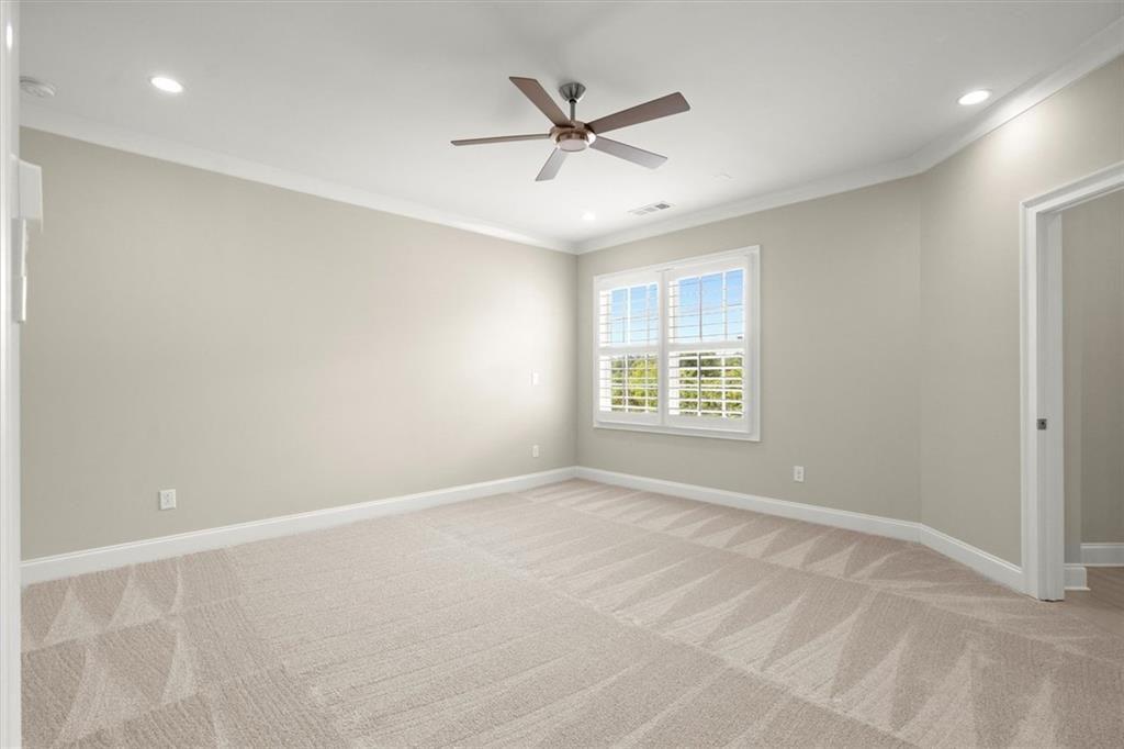 293 Thompson Street Alpharetta, GA 30009 - Photo 33 of 71 an empty room with window and ceiling fan