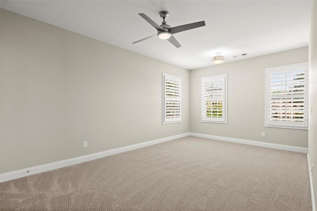 293 Thompson Street Alpharetta, GA 30009 - Photo 38 of 71 an empty room with windows and fan