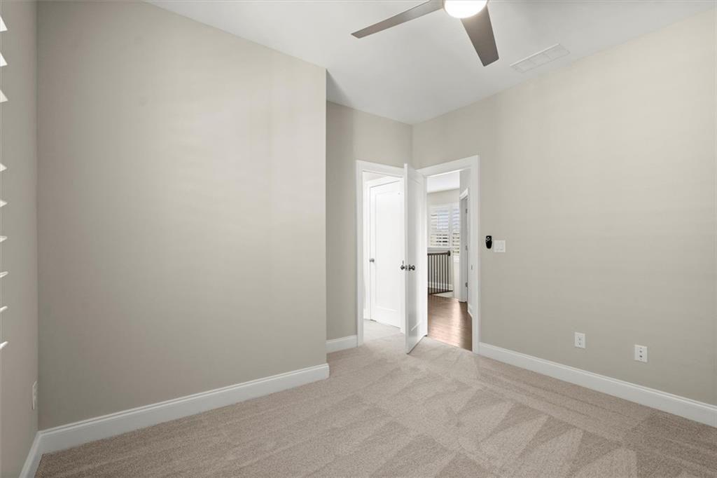 293 Thompson Street Alpharetta, GA 30009 - Photo 42 of 71 an empty room with a empty space and a ceiling fan