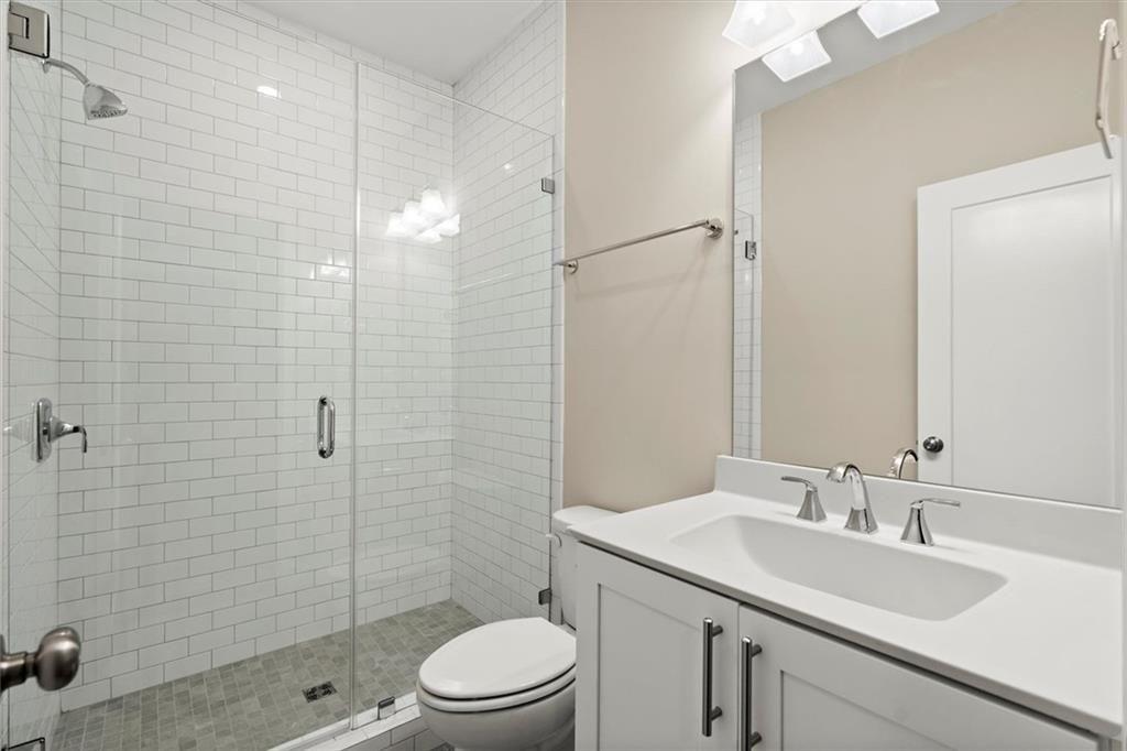 293 Thompson Street Alpharetta, GA 30009 - Photo 48 of 71 a bathroom with a sink a toilet and shower
