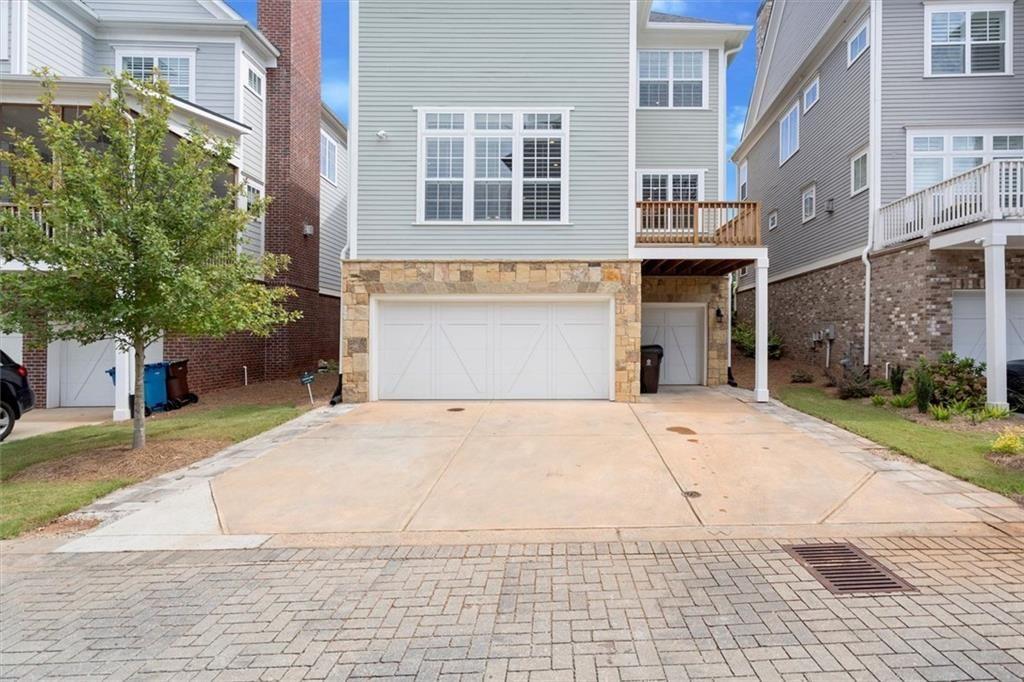 293 Thompson Street Alpharetta, GA 30009 - Photo 49 of 71 a front view of a building with a garden