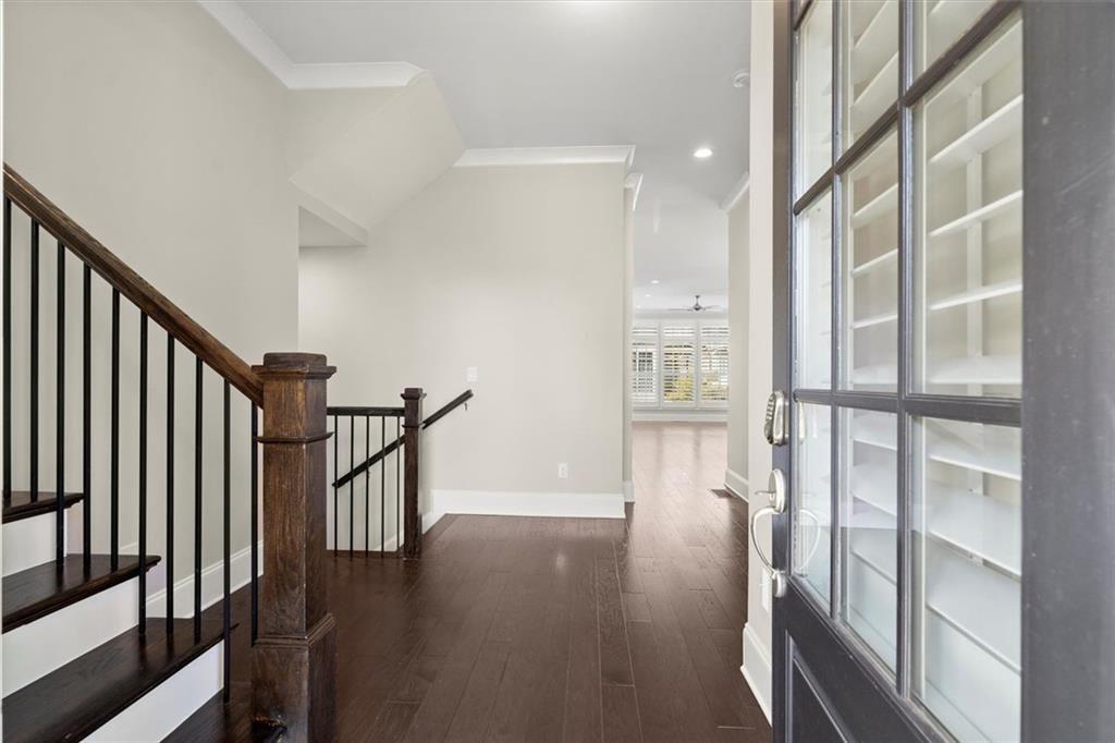 293 Thompson Street Alpharetta, GA 30009 - Photo 8 of 71 a view of staircase with wooden floor and windows