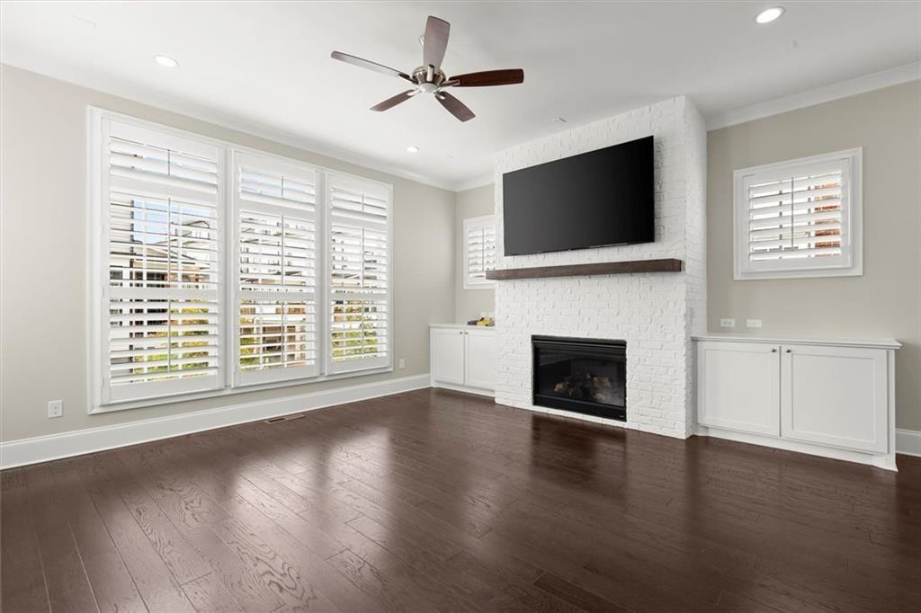 293 Thompson Street Alpharetta, GA 30009 - Photo 10 of 71 a living room with flat screen tv and a fireplace