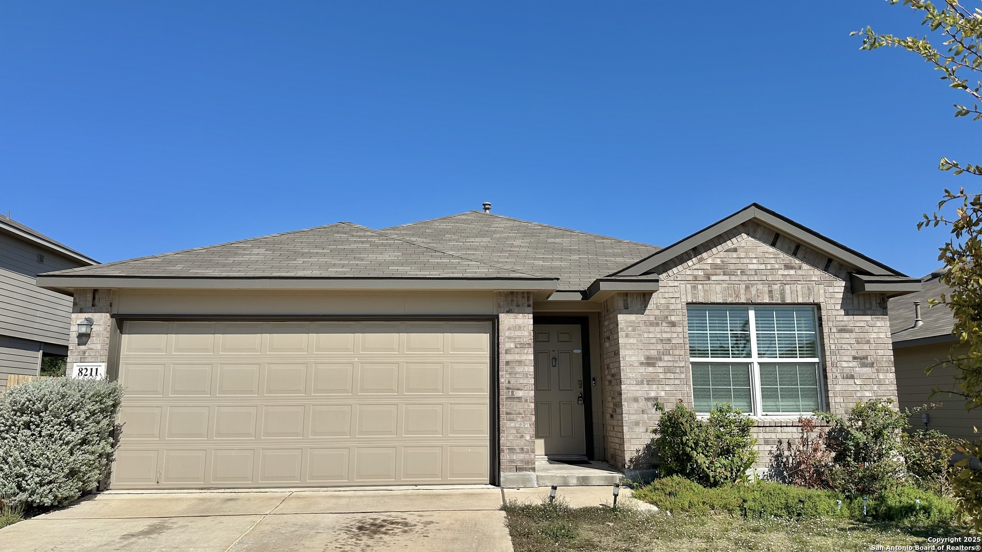 8211 Falcon Converse, TX 78109 - Photo 1 of 1 a front view of a house with garden