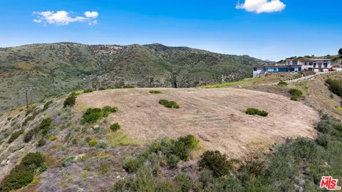 a view of a backyard of a house
