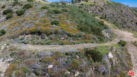a view of a big room with a mountain in the background
