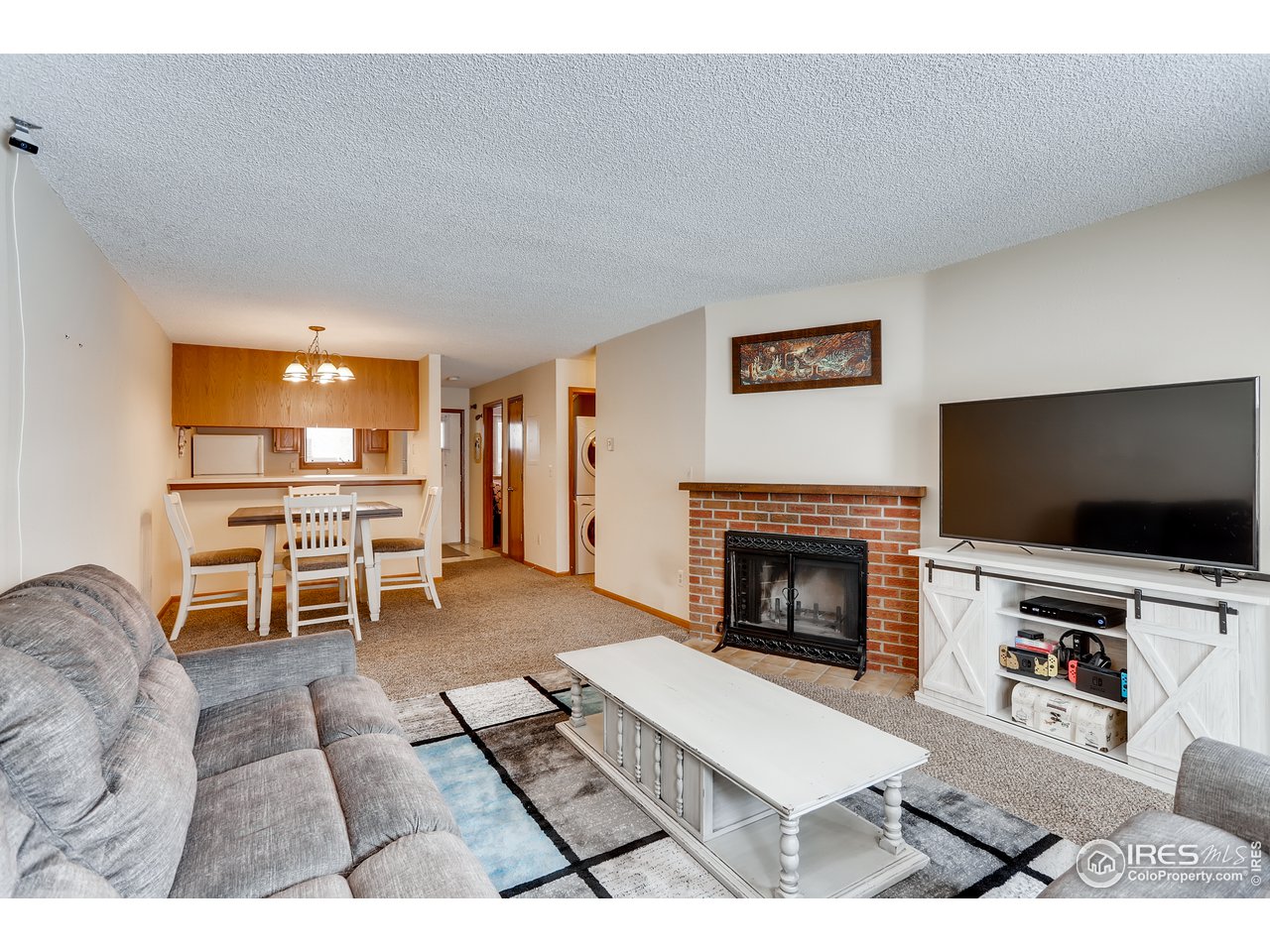 1231 West Swallow Road, Unit 311 Fort Collins, CO 80526 - Photo 9 of 28 Living Room With Fireplace
