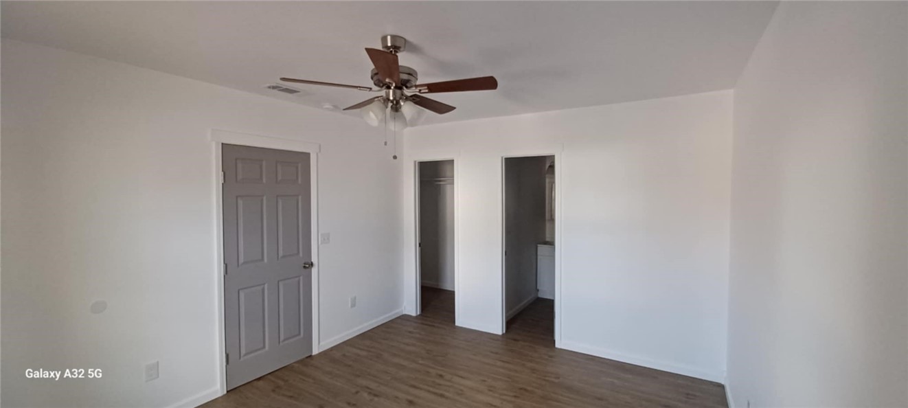 1005 Taylor Street Waco, TX 76704 - Photo 11 of 14 a view of a hallway with wooden floor