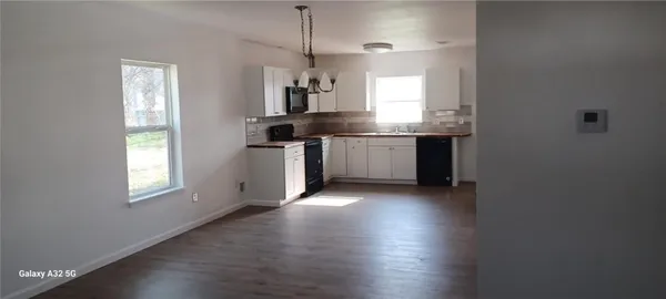 a bath room with a toilet and a bath tub