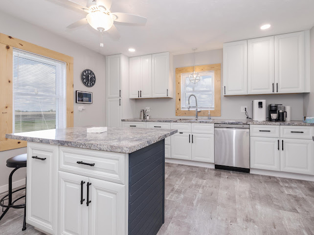 2950 County Road 1100 North Gridley, IL 61744 - Photo 18 of 38 a kitchen with granite countertop white cabinets and white appliances