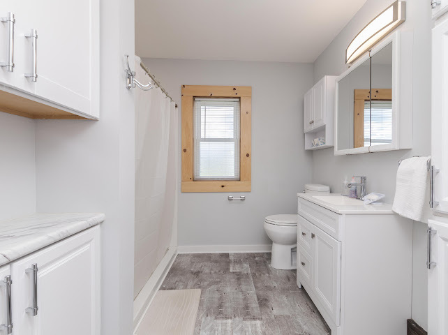 2950 County Road 1100 North Gridley, IL 61744 - Photo 19 of 38 a bathroom with a toilet sink and mirror