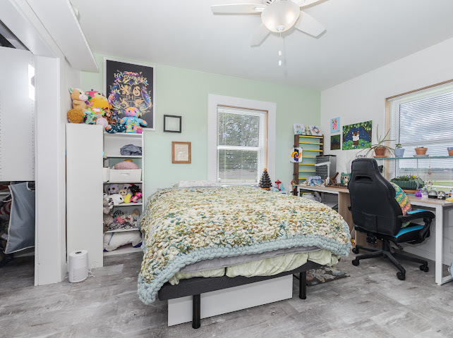 2950 County Road 1100 North Gridley, IL 61744 - Photo 21 of 38 a bedroom with bed and a desk
