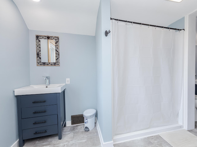 2950 County Road 1100 North Gridley, IL 61744 - Photo 29 of 38 a bathroom with a sink a toilet and shower