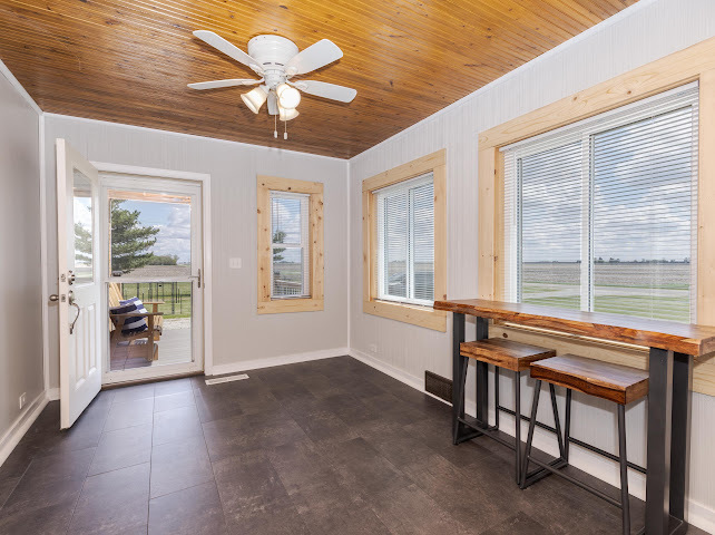 2950 County Road 1100 North Gridley, IL 61744 - Photo 7 of 38 a view of workspace with furniture and a ceiling fan