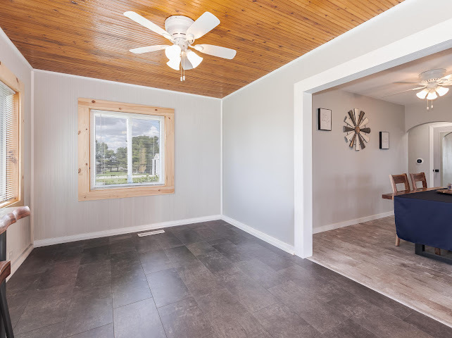 2950 County Road 1100 North Gridley, IL 61744 - Photo 8 of 38 an empty room with windows and fan