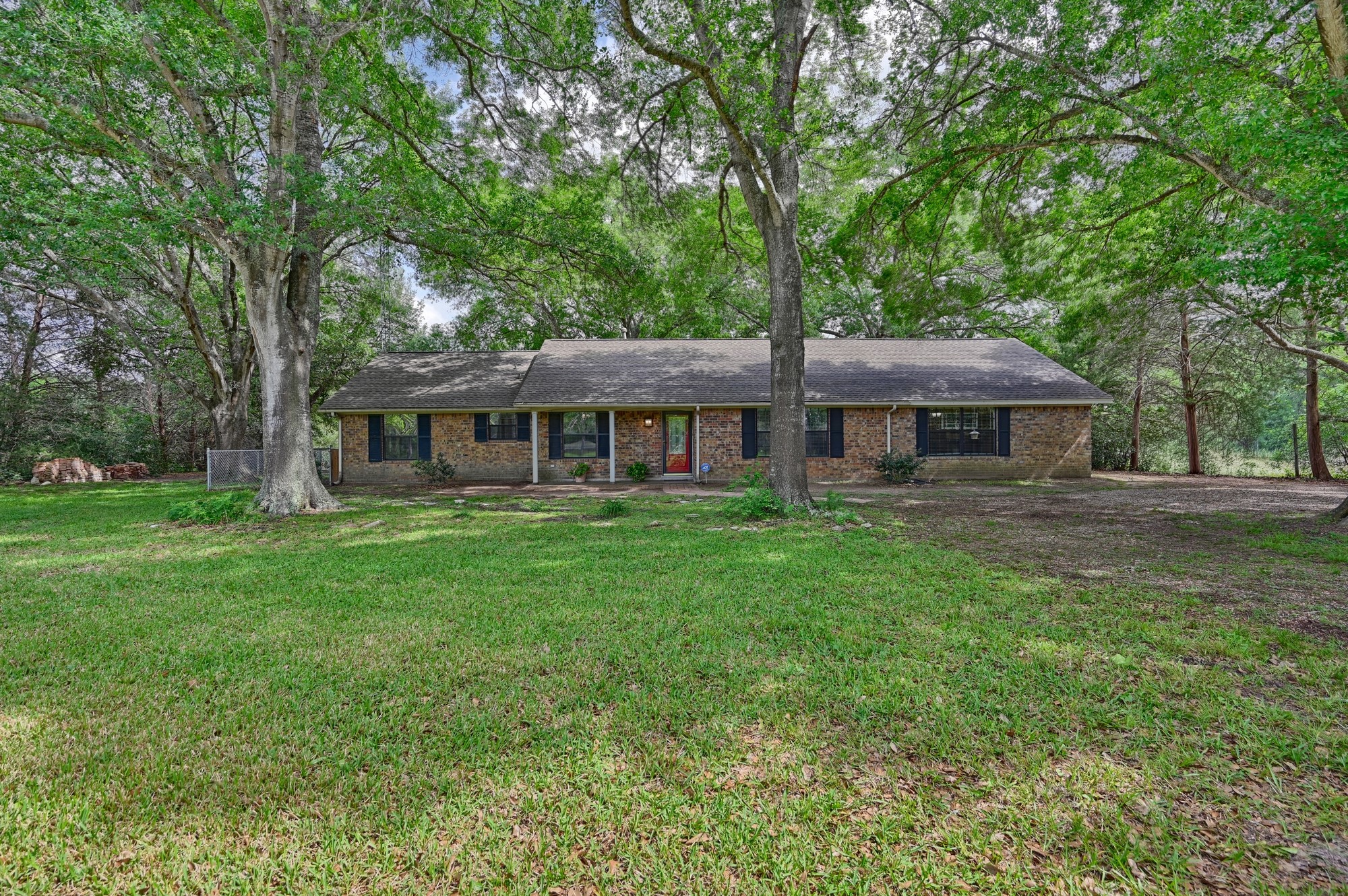 6201 Fm 389 Brenham, TX 77833 - Photo 1 of 50 a front view of a house with a garden