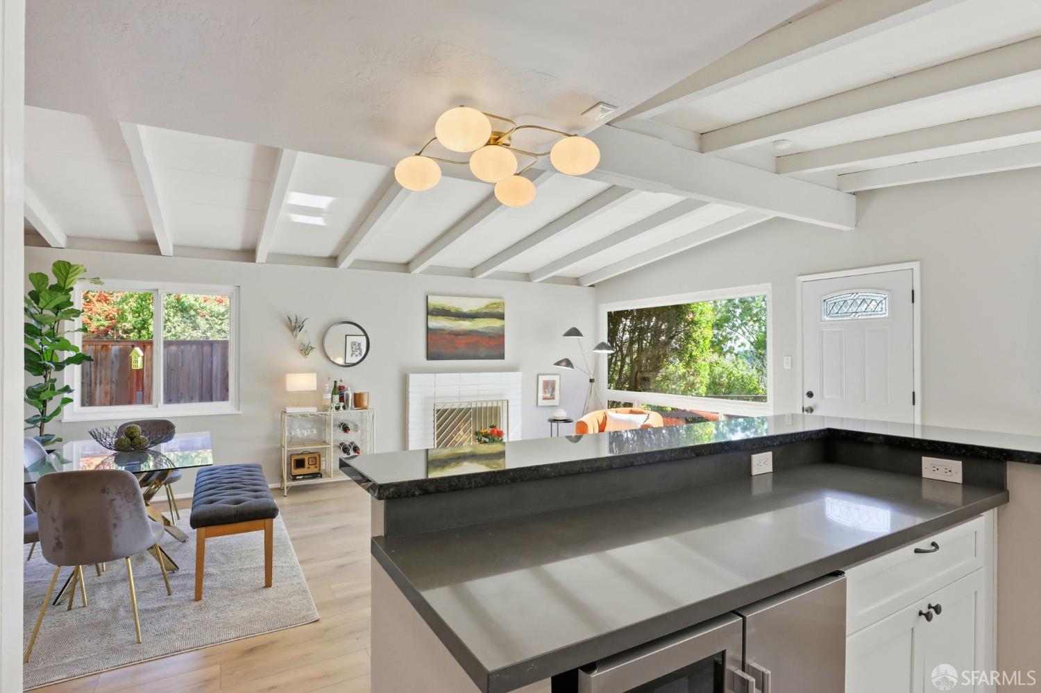 656 Pebble Drive El Sobrante, CA 94803 - Photo 18 of 41 a kitchen with a sink dishwasher and a large mirror with wooden floor