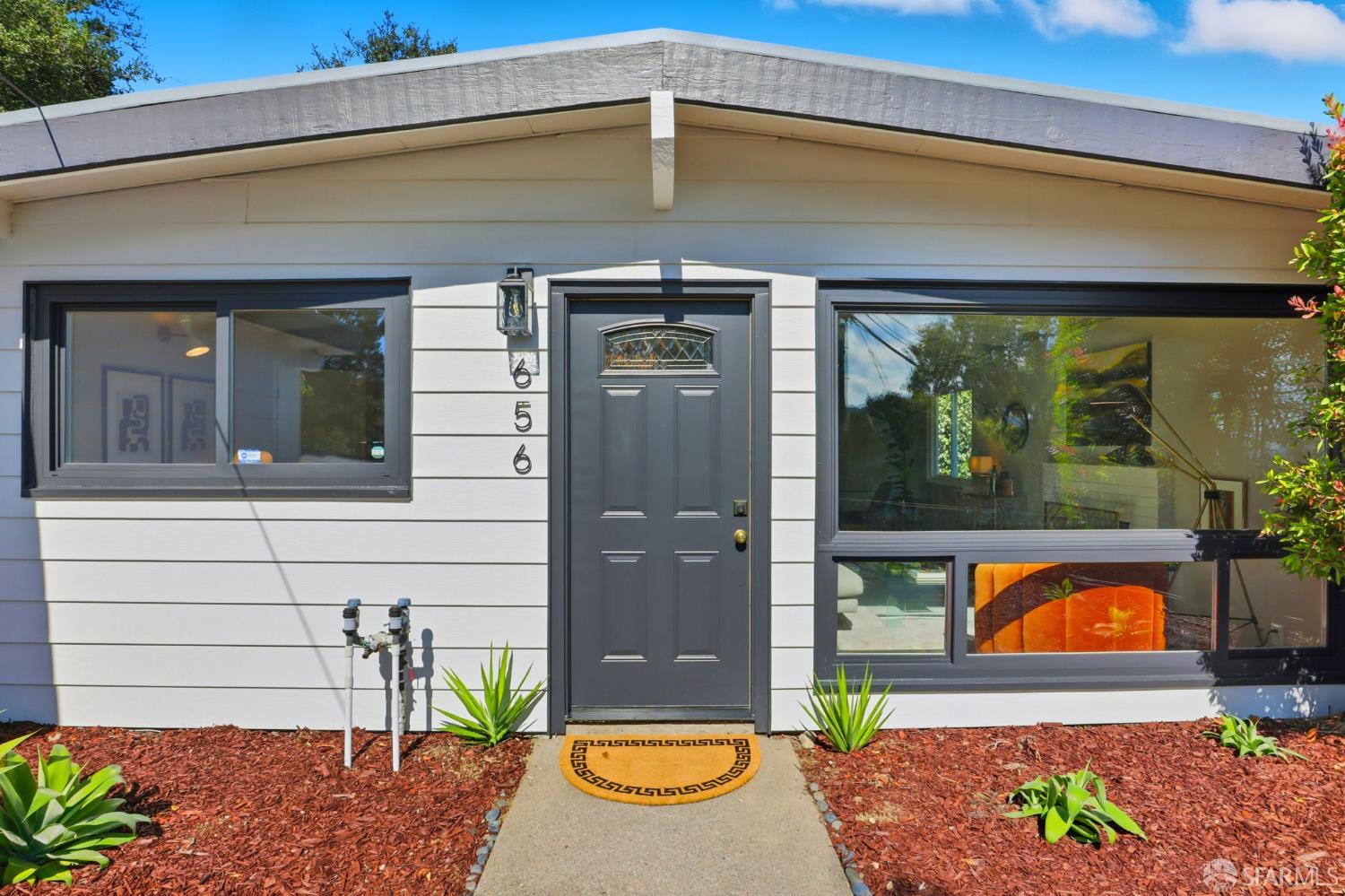 656 Pebble Drive El Sobrante, CA 94803 - Photo 2 of 41 a front view of a house with a garden