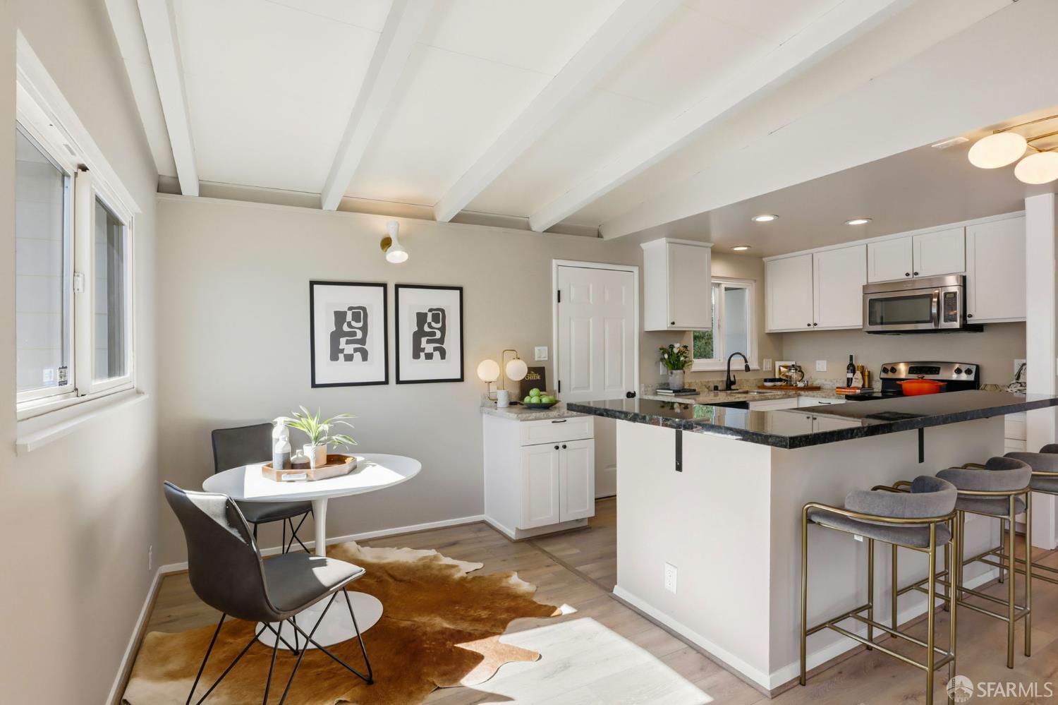 656 Pebble Drive El Sobrante, CA 94803 - Photo 21 of 41 a kitchen with a sink and chairs