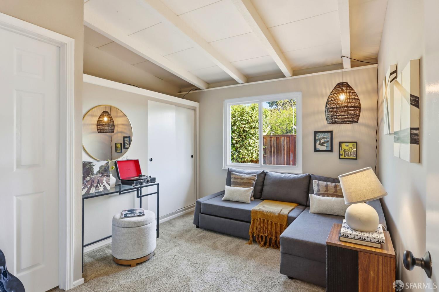 656 Pebble Drive El Sobrante, CA 94803 - Photo 26 of 41 a living room with furniture a rug and a chandelier