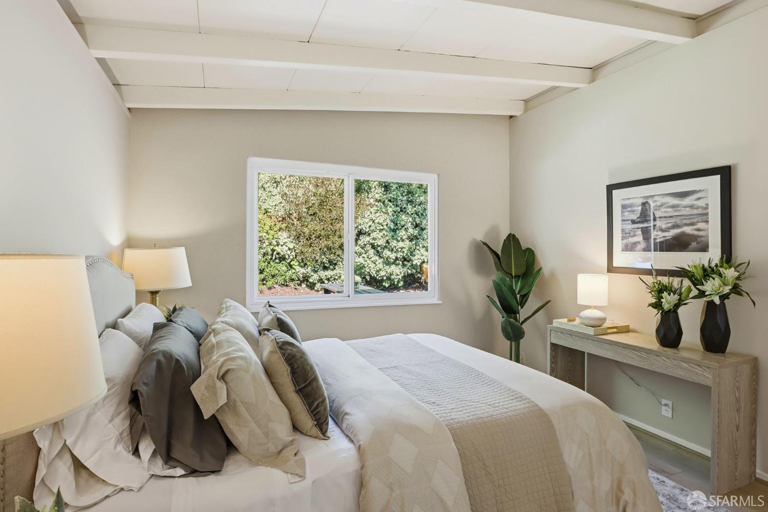 656 Pebble Drive El Sobrante, CA 94803 - Photo 28 of 41 a bedroom with a bed and a large window