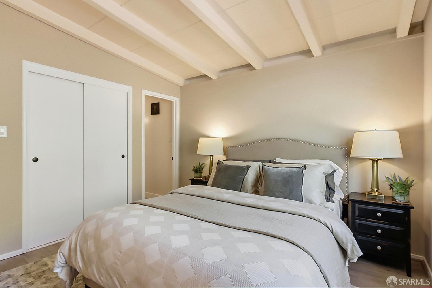 656 Pebble Drive El Sobrante, CA 94803 - Photo 29 of 41 a bedroom with a bed and a lamp