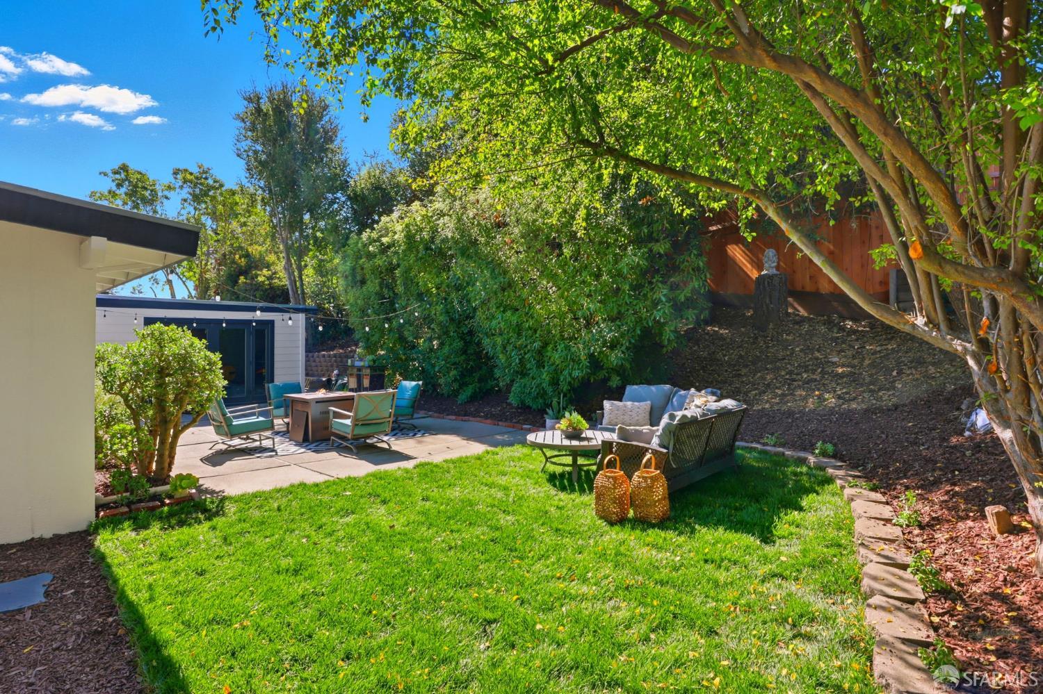 656 Pebble Drive El Sobrante, CA 94803 - Photo 35 of 41 a backyard of a house with fire pit and outdoor seating