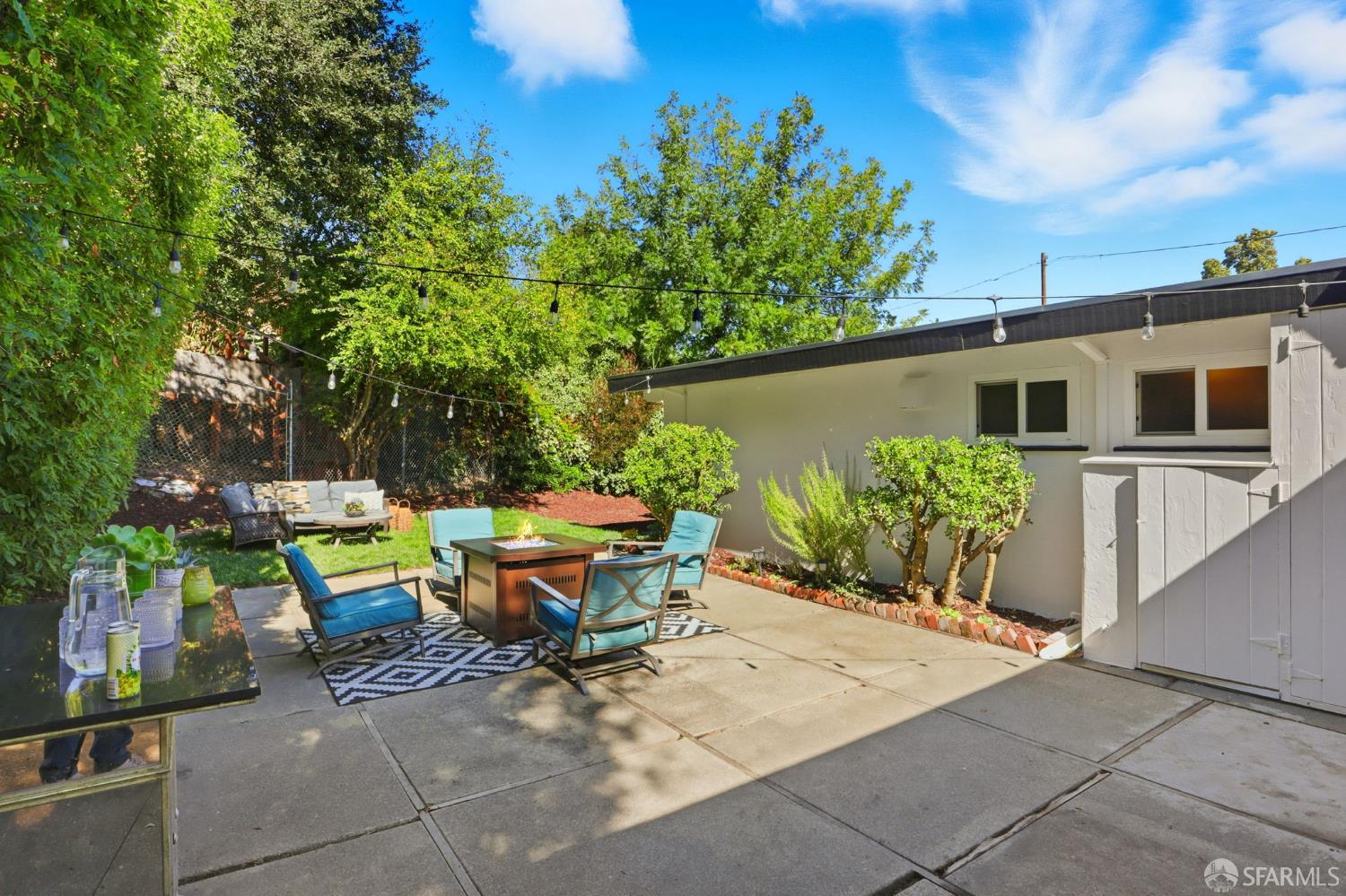656 Pebble Drive El Sobrante, CA 94803 - Photo 37 of 41 a backyard of a house with table and chairs