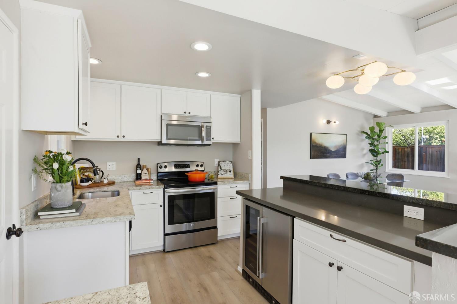 656 Pebble Drive El Sobrante, CA 94803 - Photo 5 of 41 a kitchen with a sink cabinets and stainless steel appliances