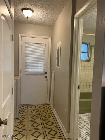 a bathroom with a glass door shower