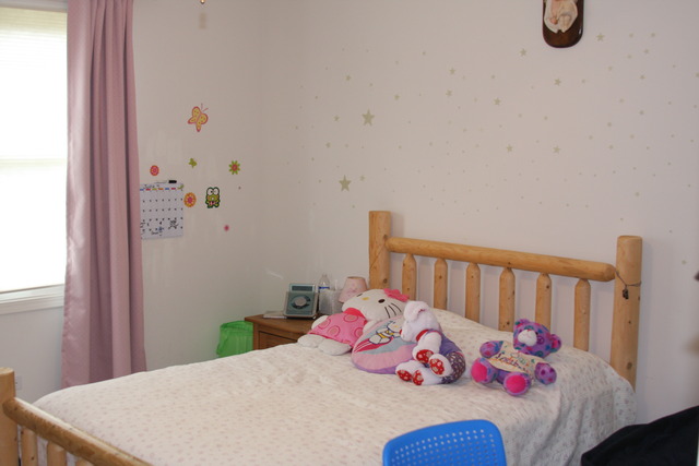 2826 Weld Road Elgin, IL 60124 - Photo 12 of 19 a bedroom with a bed and a table
