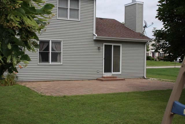 2826 Weld Road Elgin, IL 60124 - Photo 18 of 19 a view of a house with a yard and potted plants