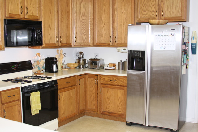2826 Weld Road Elgin, IL 60124 - Photo 7 of 19 a kitchen with stainless steel appliances granite countertop a stove a refrigerator and a sink