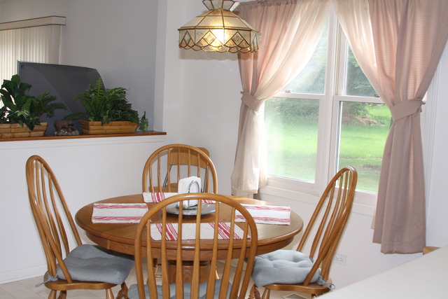 2826 Weld Road Elgin, IL 60124 - Photo 8 of 19 a view of a dining room with furniture window and outside view
