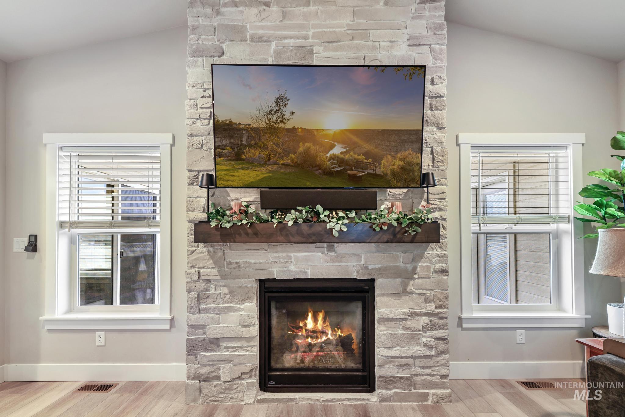 3103 Moonrise Road Twin Falls, ID 83301 - Photo 5 of 40 Detailed view of a stone fireplace and wood finished floors