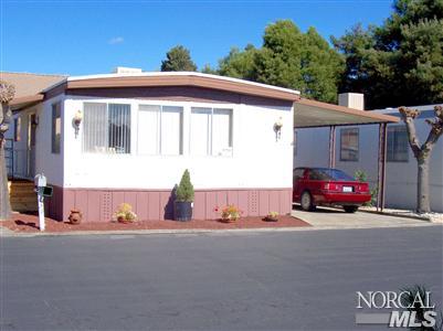 a view of a car park in front of a house