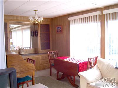 259 Ricardo Avenue, Unit 259 Santa Rosa, CA 95407 - Photo 5 of 12 a view of a dining room with furniture window and outside view