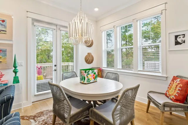 a view of a dining room with furniture window and outside view