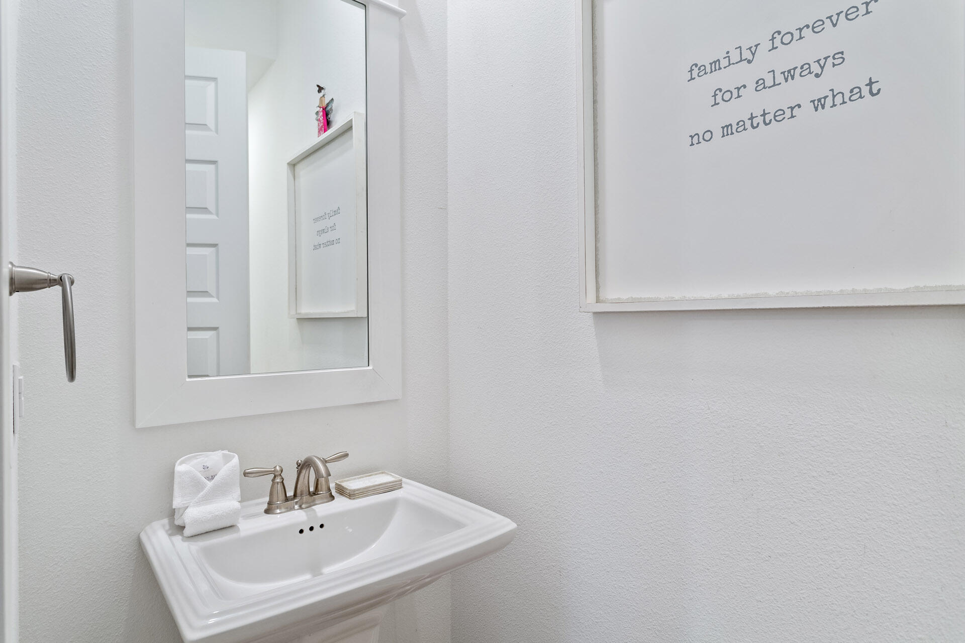 125 West W Pine, Unit B Inlet Beach, FL 32461 - Photo 11 of 14 a bathroom with a sink and a mirror
