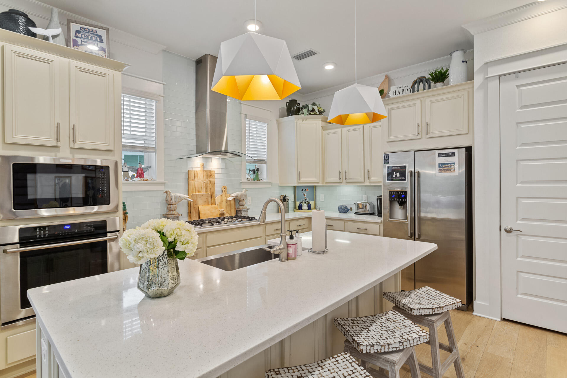 125 West W Pine, Unit B Inlet Beach, FL 32461 - Photo 3 of 14 a kitchen with stainless steel appliances granite countertop a sink a stove and a refrigerator