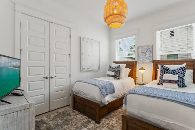 a bedroom with bed and window