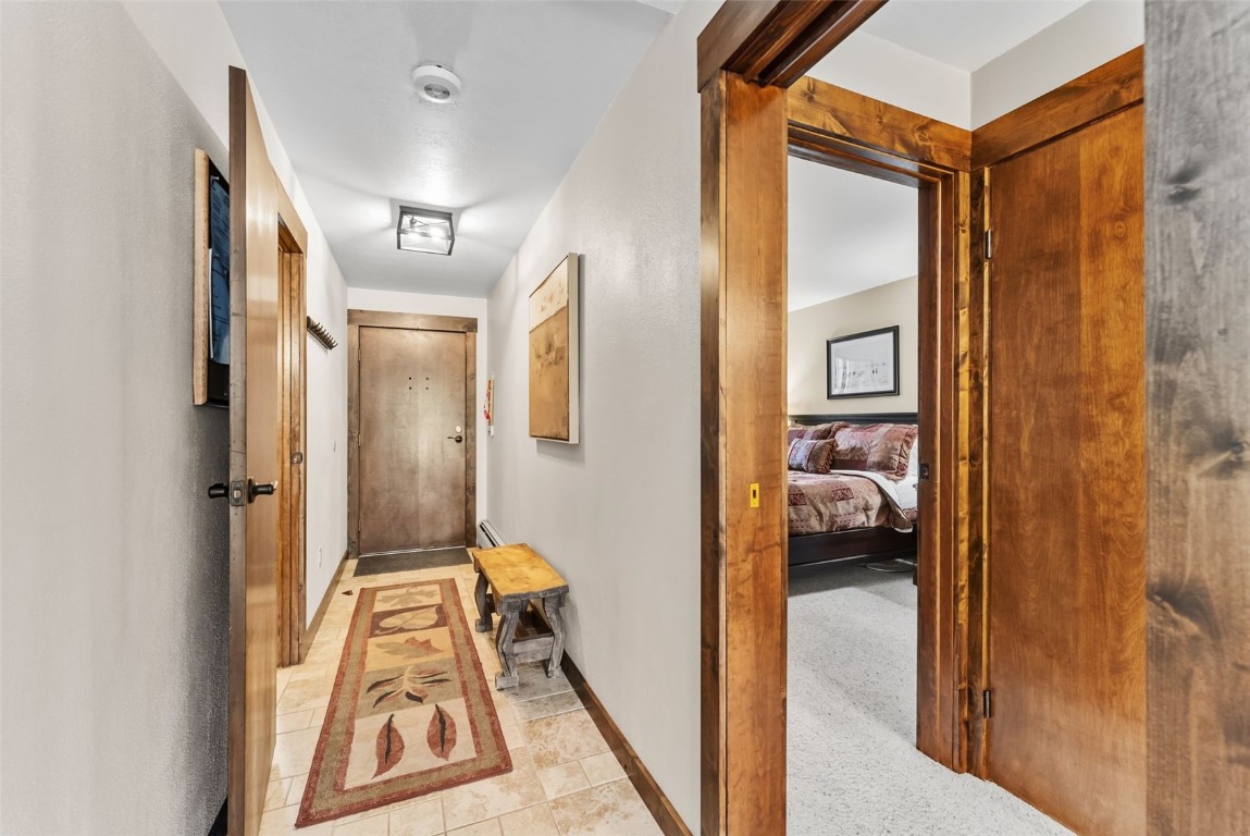 112 La Bonte Street, Unit 202 Dillon, CO 80435 - Photo 13 of 32 a en suite bathroom with a tub shower and a sink