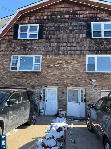 a brick house with parking space