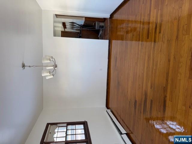 282-284 Washington Street, Unit 2 Fairview, NJ 07022 - Photo 2 of 6 a view of empty room with wooden floor