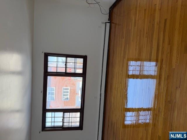 282-284 Washington Street, Unit 2 Fairview, NJ 07022 - Photo 3 of 6 a view of empty room with window