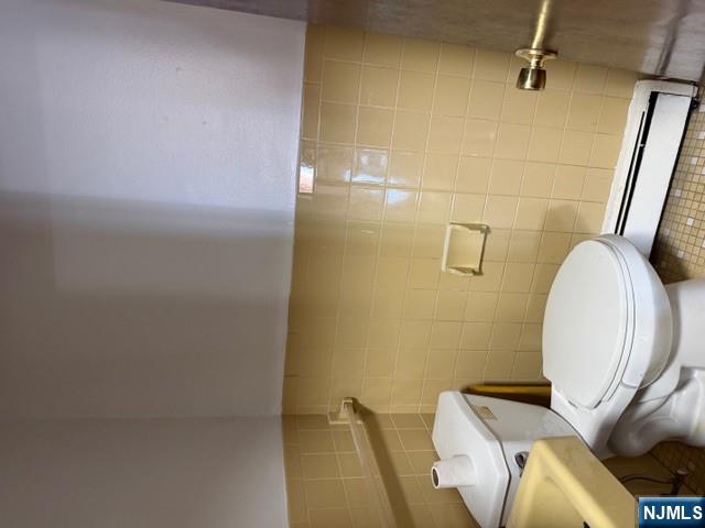 282-284 Washington Street, Unit 2 Fairview, NJ 07022 - Photo 5 of 6 a bathroom with a toilet and a shower