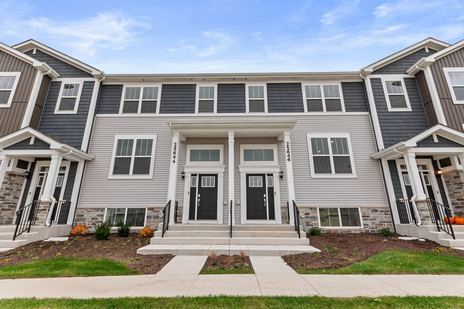 a view of a brick building next to a yard
