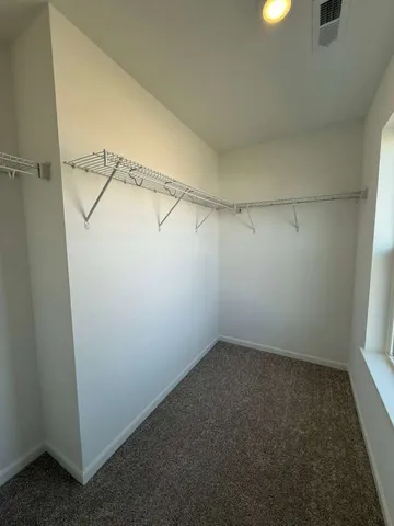 a view of a room with racks on the wall