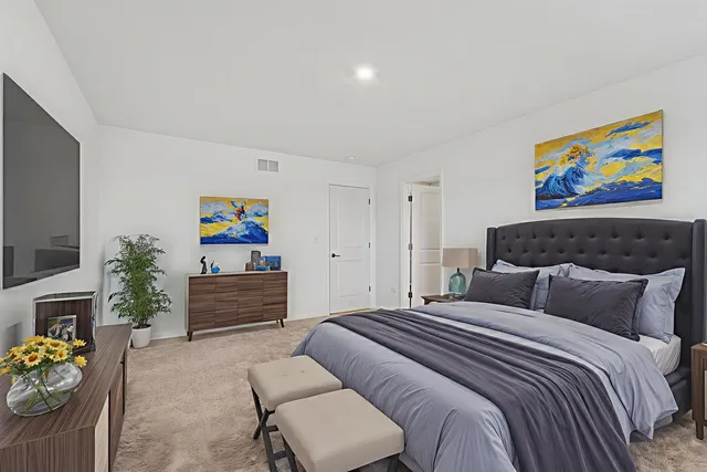 a bedroom with furniture a bed and a couch