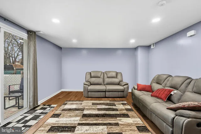 a living room with furniture and a rug